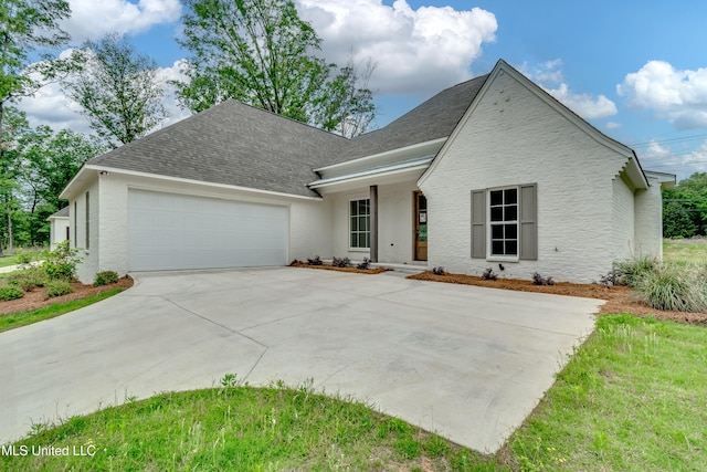 124 Grayson Way, Madison, MS 39110 - view of front of property with a garage, driveway, and roof with shingles