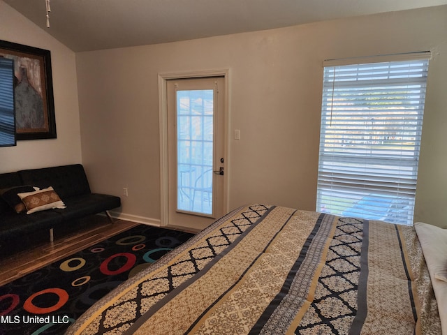 bedroom with lofted ceiling