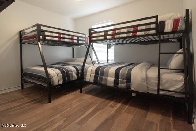 bedroom with wood-type flooring