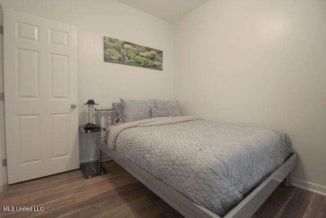 bedroom featuring dark hardwood / wood-style floors