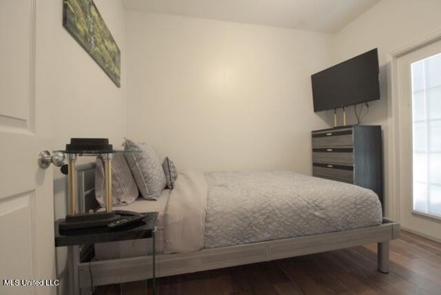 bedroom featuring dark hardwood / wood-style floors