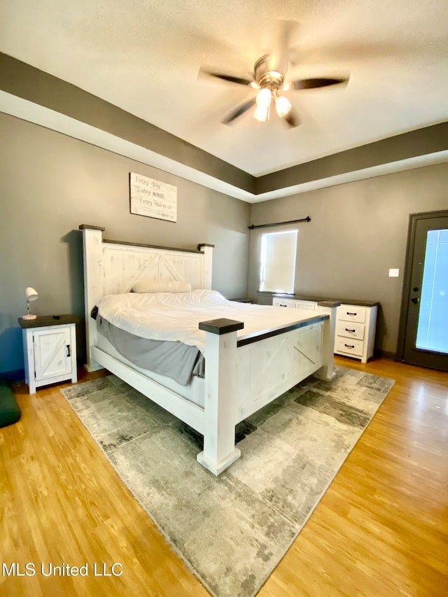 unfurnished bedroom featuring ceiling fan and light hardwood / wood-style flooring