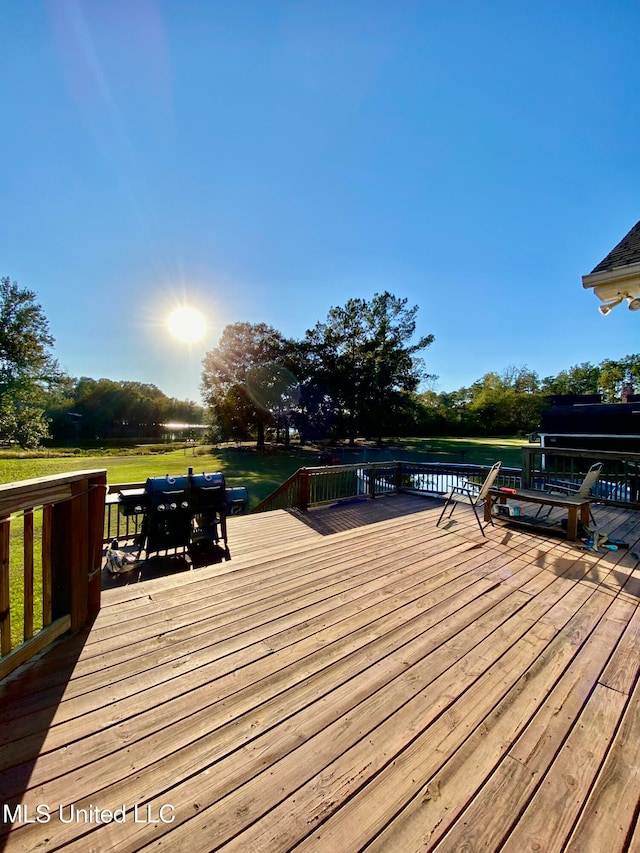 wooden terrace with a water view