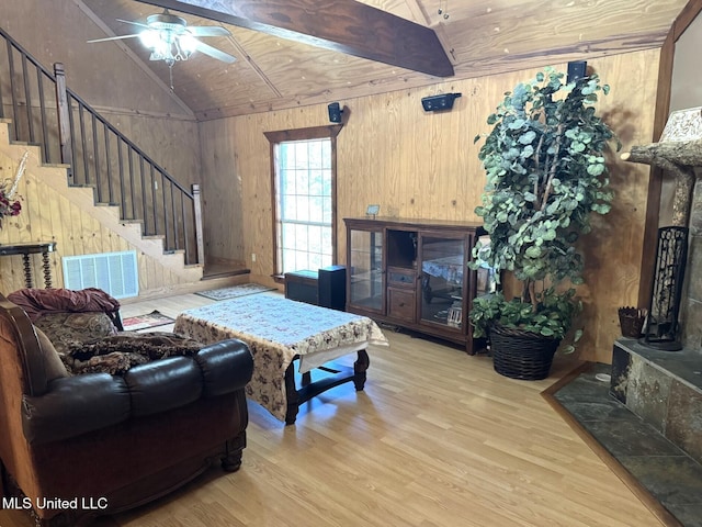 46 Stirling Rd, Natchez, MS 39120 - living room with wood ceiling, lofted ceiling with beams, light wood-type flooring, and wooden walls