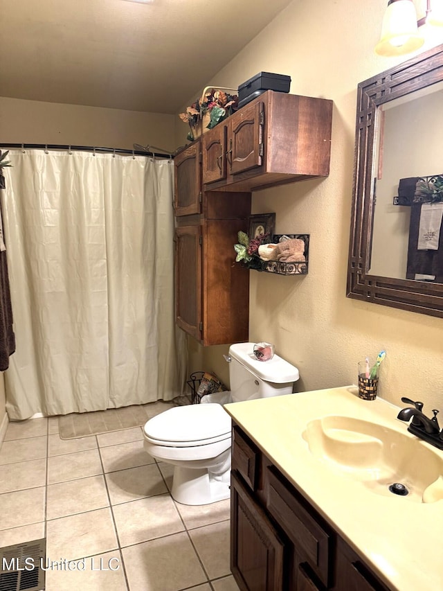 46 Stirling Rd, Natchez, MS 39120 - bathroom with tile patterned flooring, vanity, and toilet