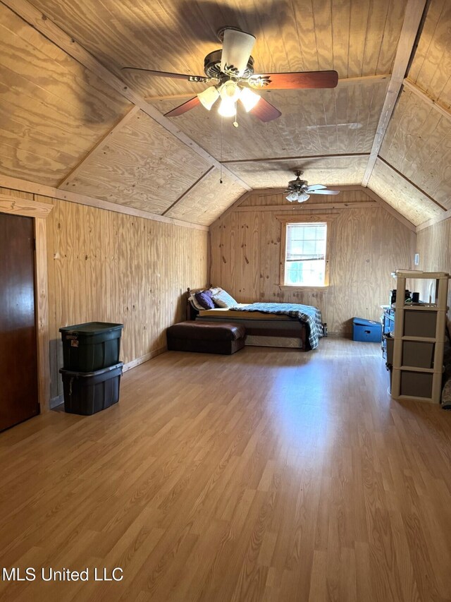 46 Stirling Rd, Natchez, MS 39120 - unfurnished bedroom featuring wood walls, hardwood / wood-style floors, wooden ceiling, and lofted ceiling