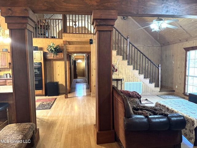 46 Stirling Rd, Natchez, MS 39120 - living room featuring ceiling fan, wooden ceiling, light hardwood / wood-style floors, vaulted ceiling, and wooden walls