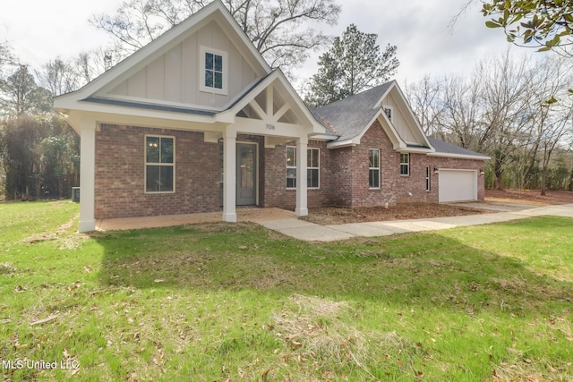 view of front facade featuring a garage and a front lawn