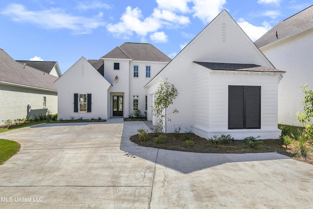 126 Herons Bay Cir Lot 1136, Madison, MS 39110 - french provincial home featuring concrete driveway, roof with shingles, and french doors