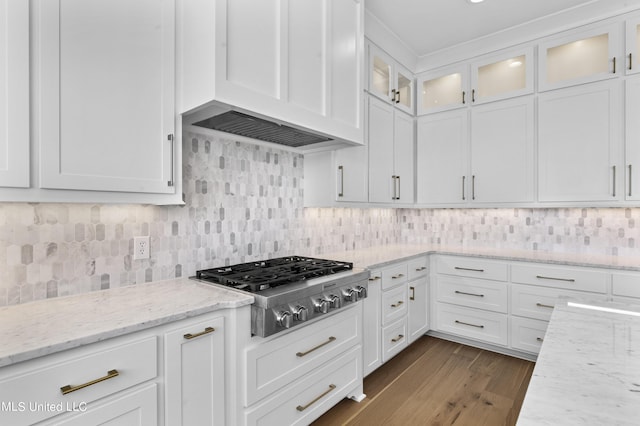 126 Herons Bay Cir Lot 1136, Madison, MS 39110 - kitchen with tasteful backsplash, stainless steel gas stovetop, premium range hood, white cabinets, and dark wood-style floors