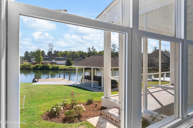 dock area featuring a yard and a water view