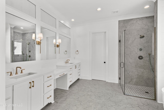 bathroom with vanity and a shower with shower door