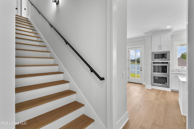 126 Herons Bay Cir Lot 1136, Madison, MS 39110 - stairway featuring baseboards, ornamental molding, wood finished floors, and recessed lighting