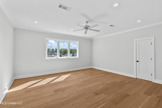 unfurnished room with ornamental molding, light wood-type flooring, and ceiling fan