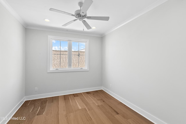 spare room with crown molding, wood-type flooring, and ceiling fan