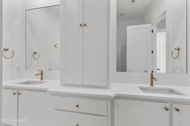 bathroom with vanity and ornamental molding