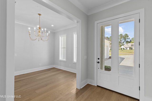 126 Herons Bay Cir Lot 1136, Madison, MS 39110 - entryway featuring wood finished floors, a notable chandelier, baseboards, and ornamental molding