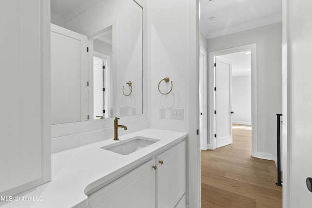 126 Herons Bay Cir Lot 1136, Madison, MS 39110 - bathroom featuring baseboards, crown molding, vanity, and wood finished floors