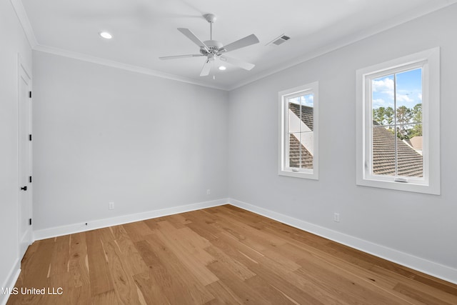 unfurnished room with ceiling fan, ornamental molding, and light hardwood / wood-style flooring