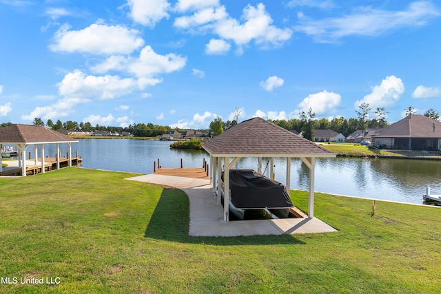 dock area featuring a lawn and a water view