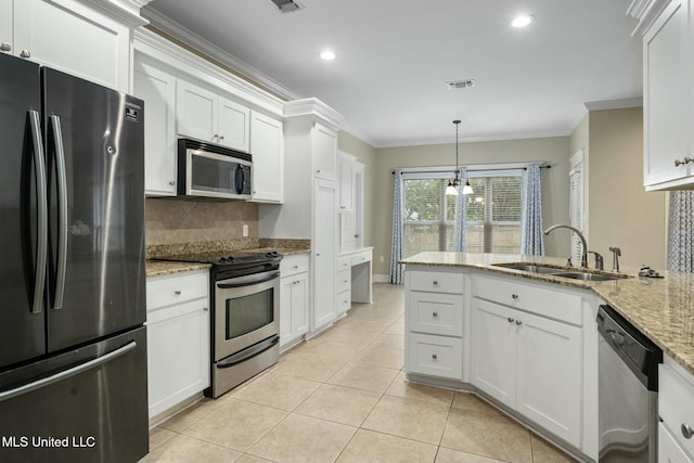 kitchen with light tile patterned flooring, stainless steel appliances, a peninsula, a sink, and ornamental molding