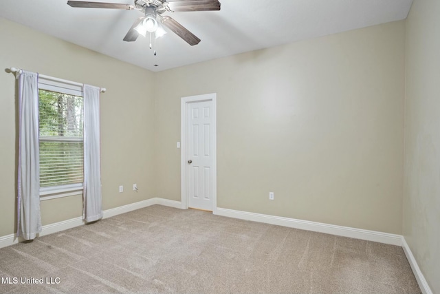 unfurnished room with ceiling fan, carpet floors, and baseboards