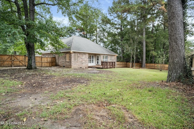 view of yard featuring a fenced backyard and a deck