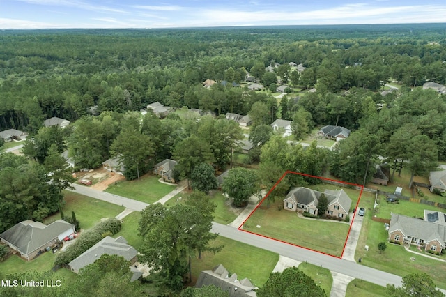 aerial view featuring a residential view and a view of trees