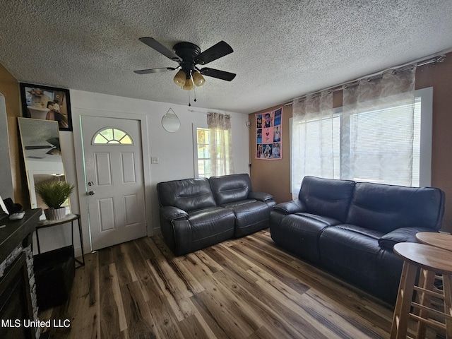 2305 Roberts Ave, Gulfport, MS 39501 - living area featuring dark wood-type flooring, a ceiling fan, and a textured ceiling