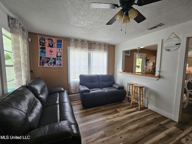 2305 Roberts Ave, Gulfport, MS 39501 - living area with wood finished floors, ceiling fan, and a textured ceiling