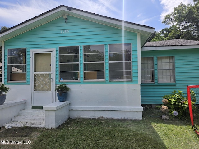 2305 Roberts Ave, Gulfport, MS 39501 - view of home's exterior with entry steps and a lawn