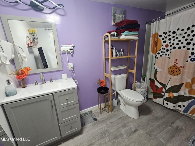 2305 Roberts Ave, Gulfport, MS 39501 - bathroom featuring wood finished floors, vanity, and curtained shower