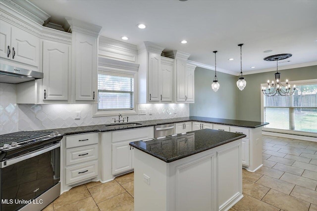 306 Canebreak Cv, Madison, MS 39110 - kitchen featuring stainless steel appliances, a peninsula, a sink, under cabinet range hood, and light tile patterned floors