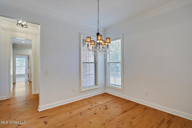 306 Canebreak Cv, Madison, MS 39110 - unfurnished dining area featuring a chandelier, light wood-style floors, ornamental molding, and baseboards