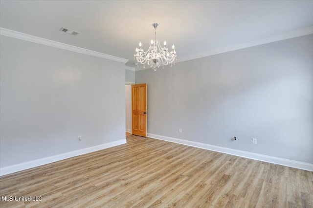 306 Canebreak Cv, Madison, MS 39110 - unfurnished room with ornamental molding, baseboards, a chandelier, and light wood-type flooring