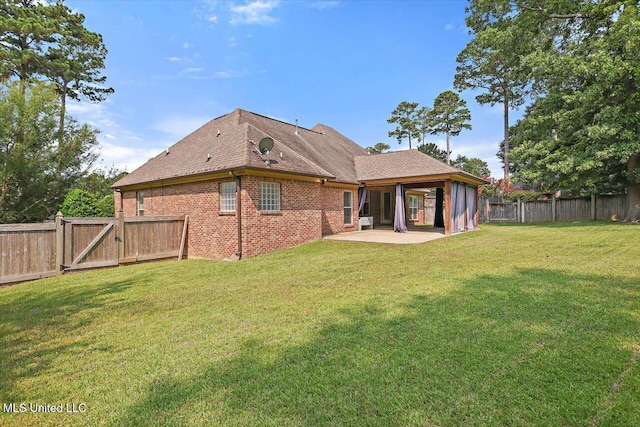306 Canebreak Cv, Madison, MS 39110 - rear view of property featuring a patio, a gate, brick siding, and roof with shingles