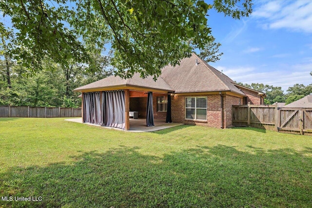 306 Canebreak Cv, Madison, MS 39110 - back of property with a patio area, brick siding, a gate, and a shingled roof