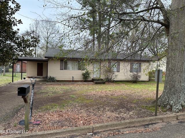 single story home with a carport