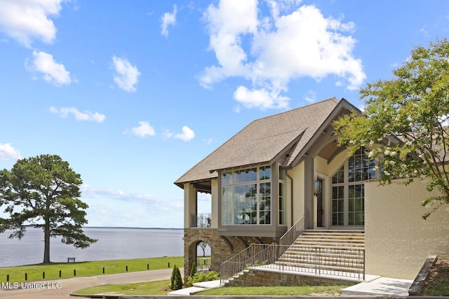 150 Old Trace Rd, Madison, MS 39110 - view of home's exterior with a water view, a shingled roof, stairs, and a sunroom