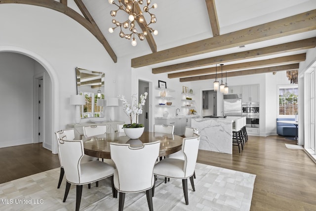 150 Old Trace Rd, Madison, MS 39110 - dining area featuring arched walkways, a chandelier, and light wood finished floors
