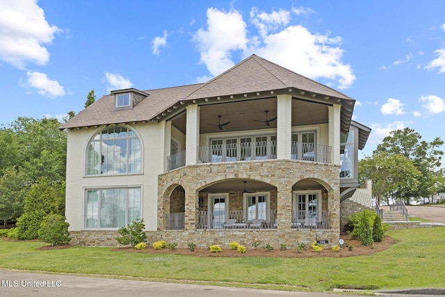 150 Old Trace Rd, Madison, MS 39110 - view of front of home with a balcony, stone siding, a front yard, and ceiling fan