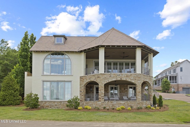 150 Old Trace Rd, Madison, MS 39110 - view of front of house with a balcony, a front yard, stone siding, and covered porch