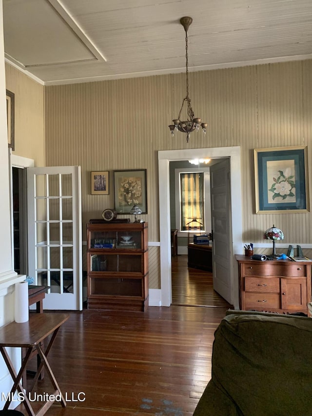 interior space featuring a notable chandelier and dark wood-type flooring