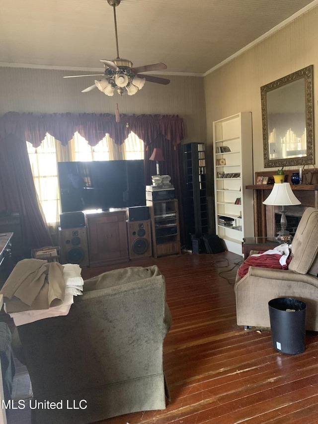 living room with ceiling fan, ornamental molding, and hardwood / wood-style floors