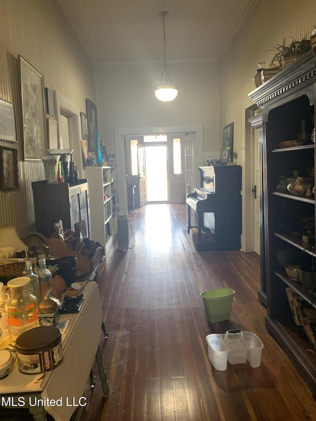 hallway with crown molding and dark hardwood / wood-style floors