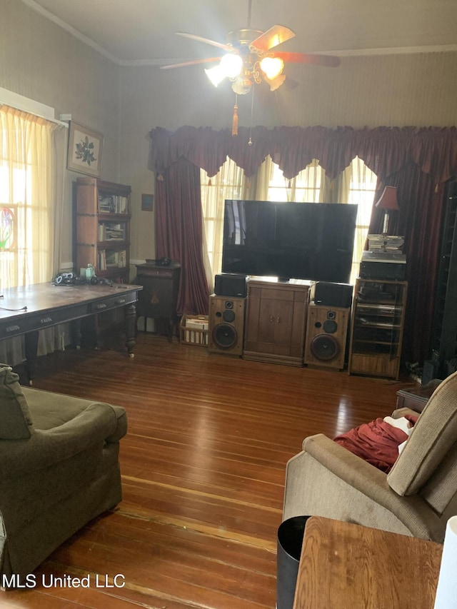 living room with hardwood / wood-style floors, ornamental molding, a healthy amount of sunlight, and ceiling fan