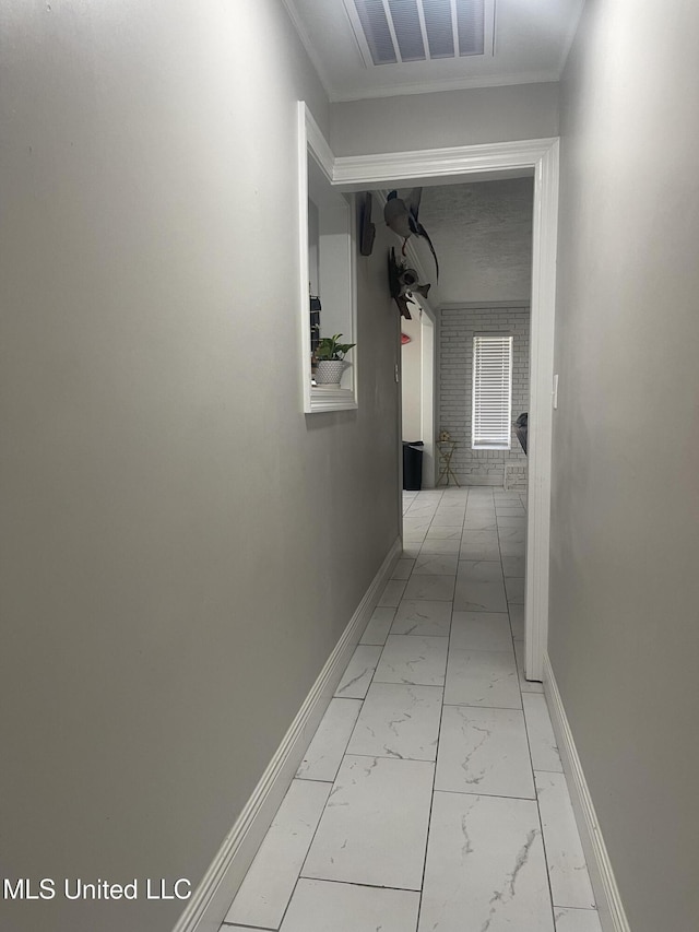 hall featuring marble finish floor, visible vents, and baseboards