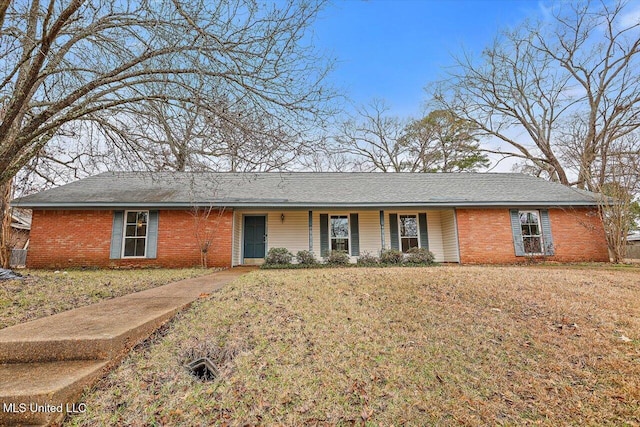 single story home featuring a front yard