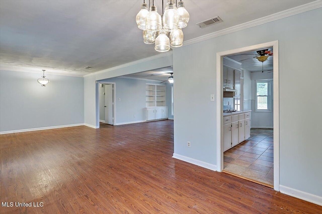 interior space featuring hardwood / wood-style flooring, ornamental molding, ceiling fan, and built in shelves