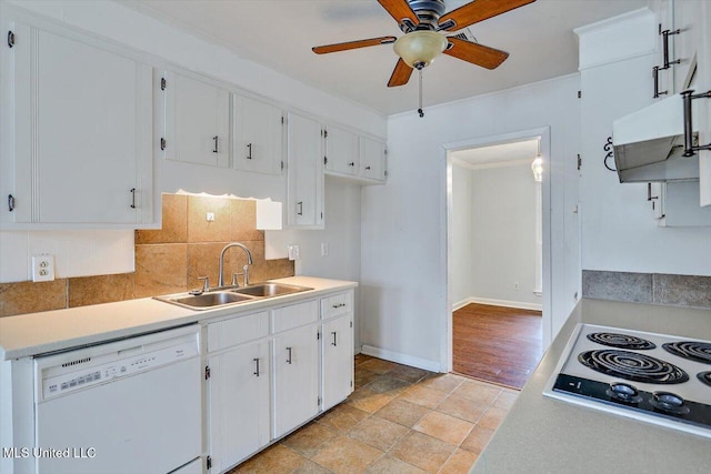 kitchen featuring tasteful backsplash, sink, white cabinets, and white appliances